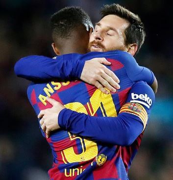 Ansu Fati with Lionel Messi.